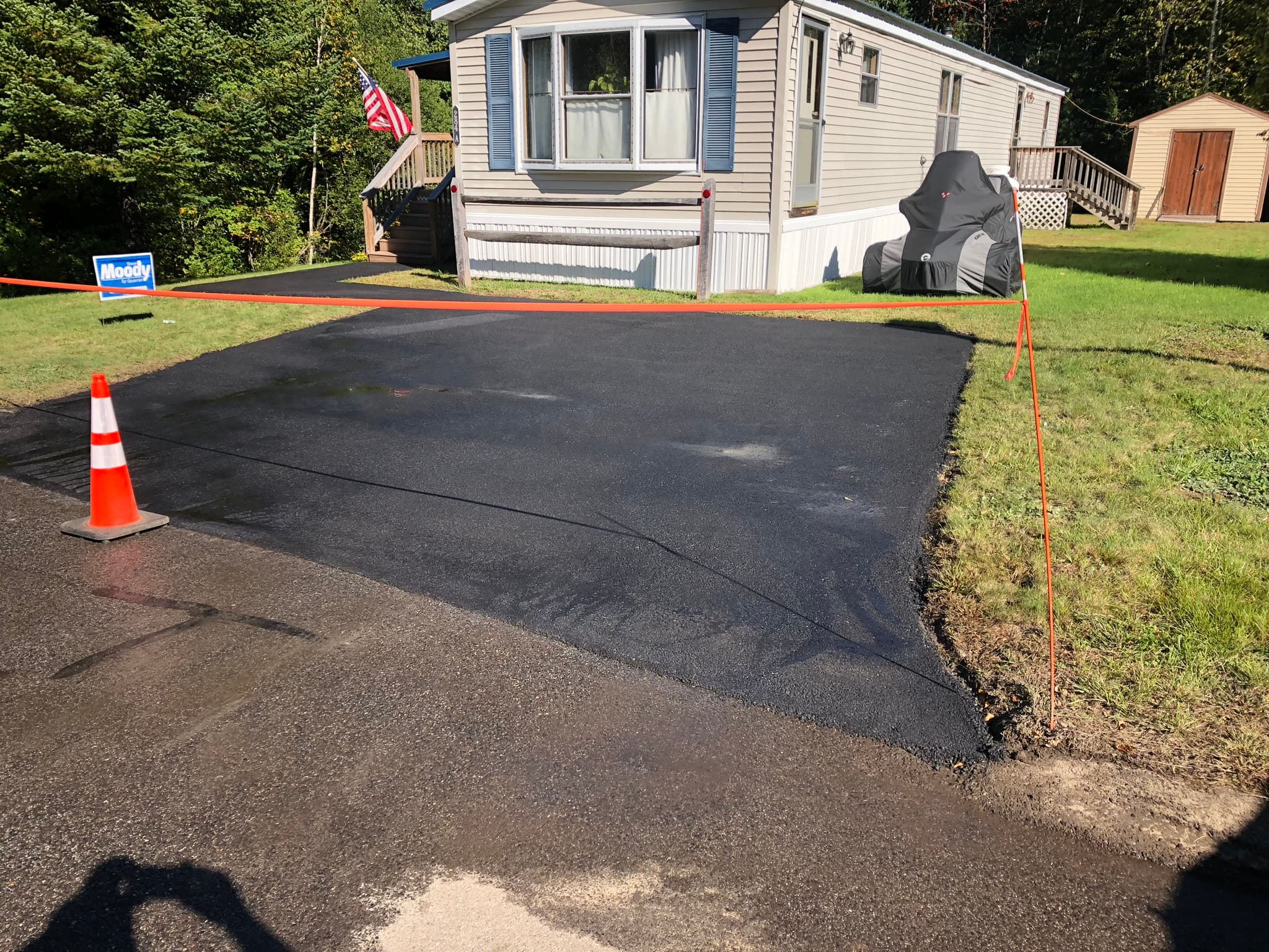 Steep hillside driveway fully sealed, even coverage top to bottom